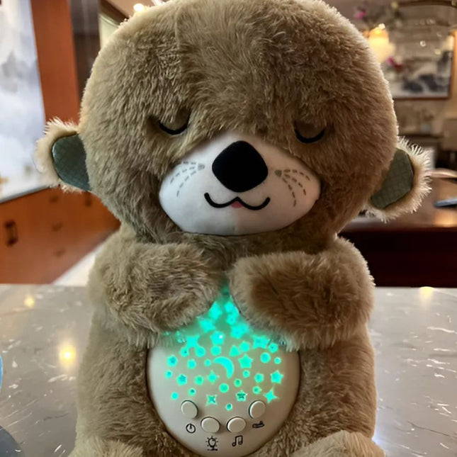 Schlafender Otter Plüschtier mit Sternenprojektor