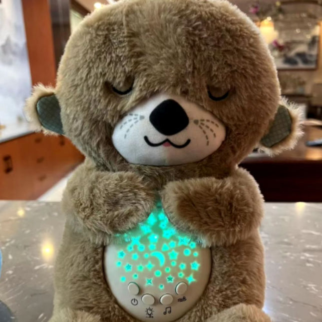 Schlafender Otter Plüschtier mit Sternenprojektor