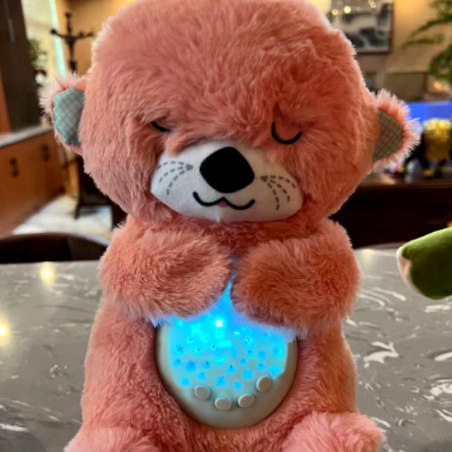 Schlafender Otter Plüschtier mit Sternenprojektor